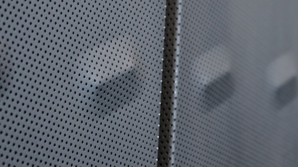 Detail of the perforated and bumped metal used on the new building.